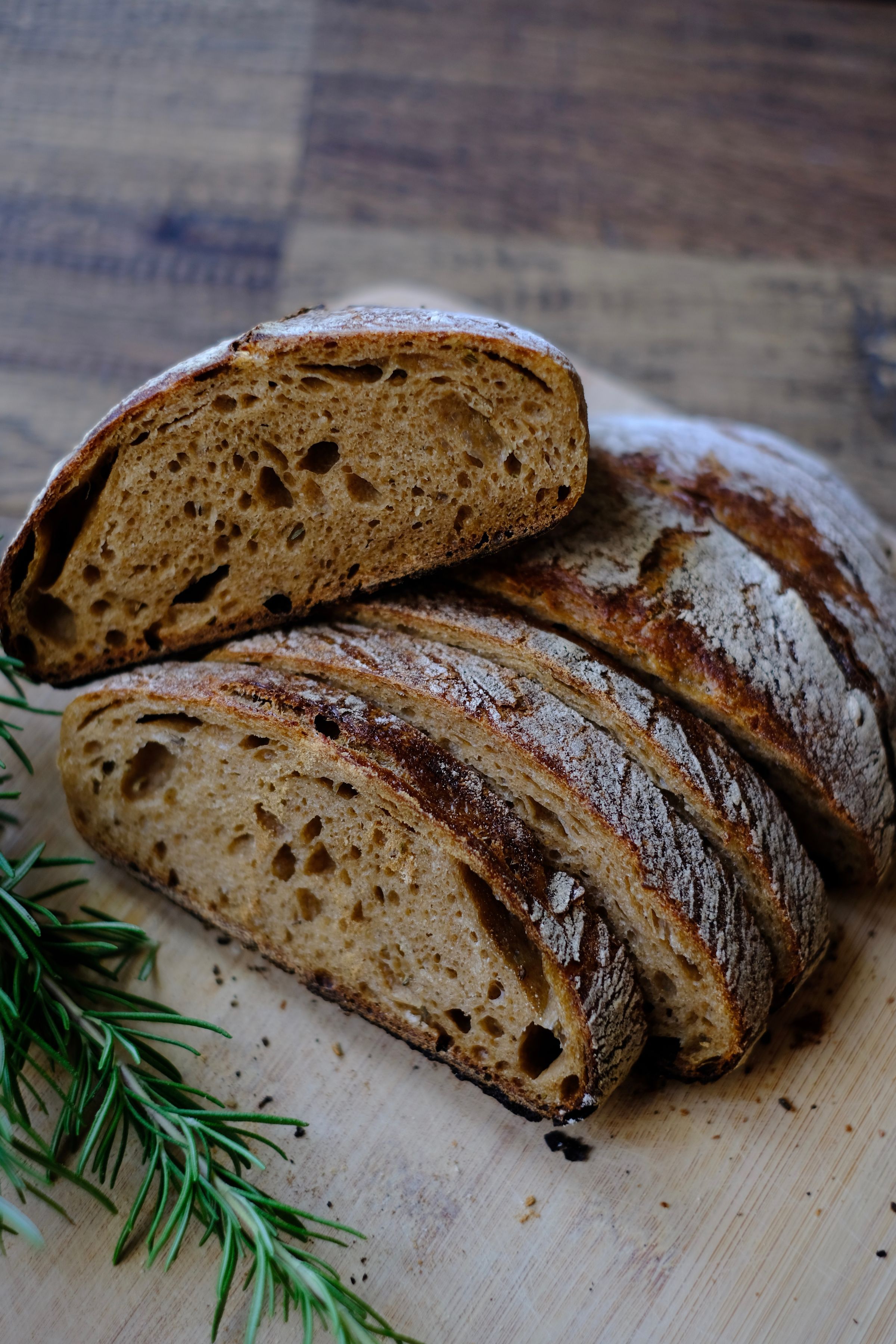 Sliced loaves of bread on a wooden board